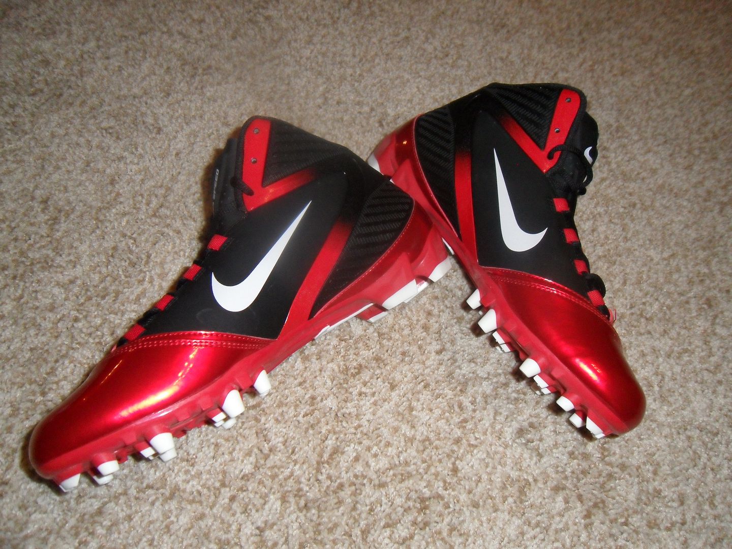 red and black nike football cleats